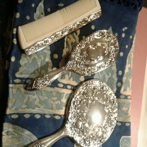 Antique mirror, brush, and comb set.